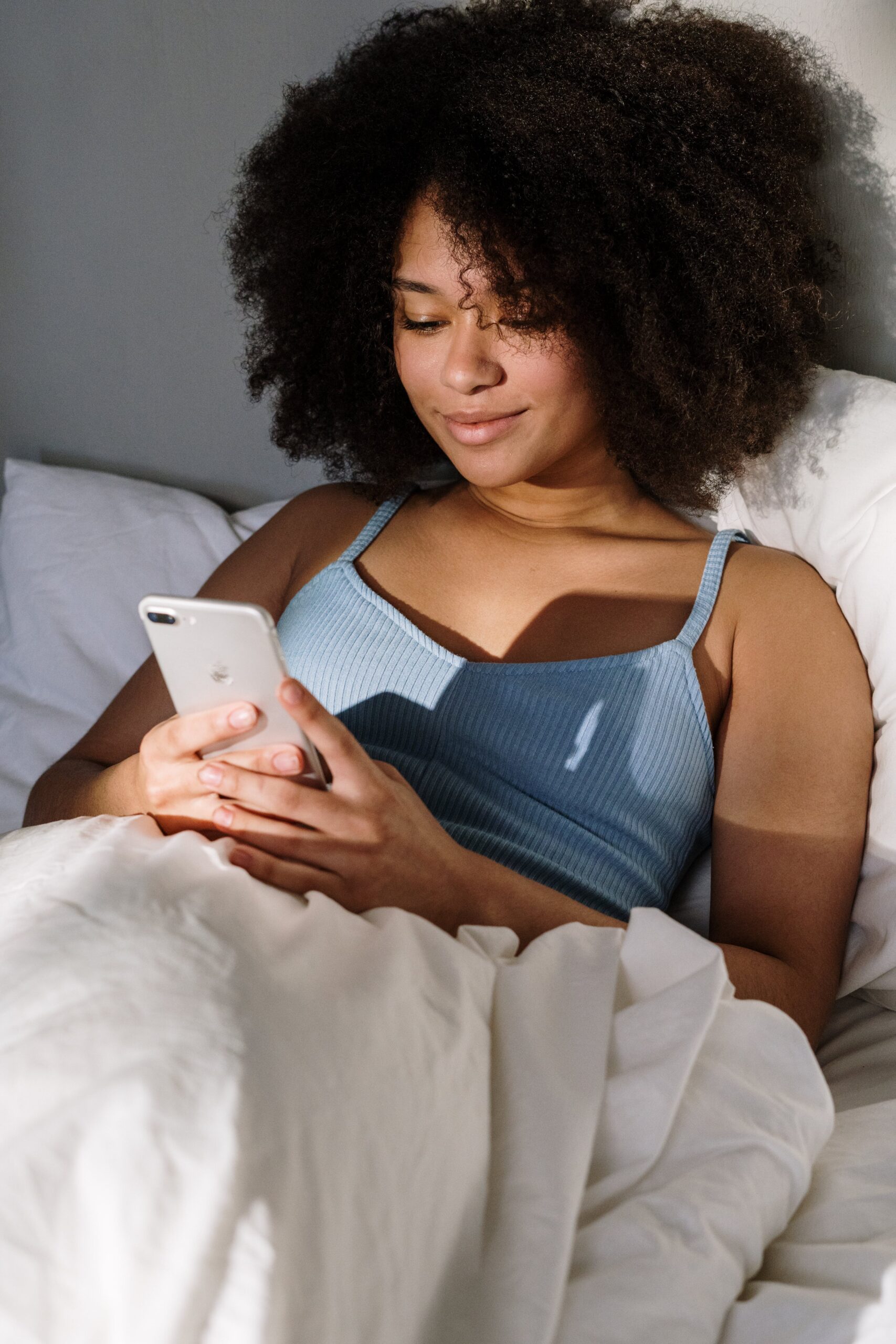 woman-in-bed-on-phone